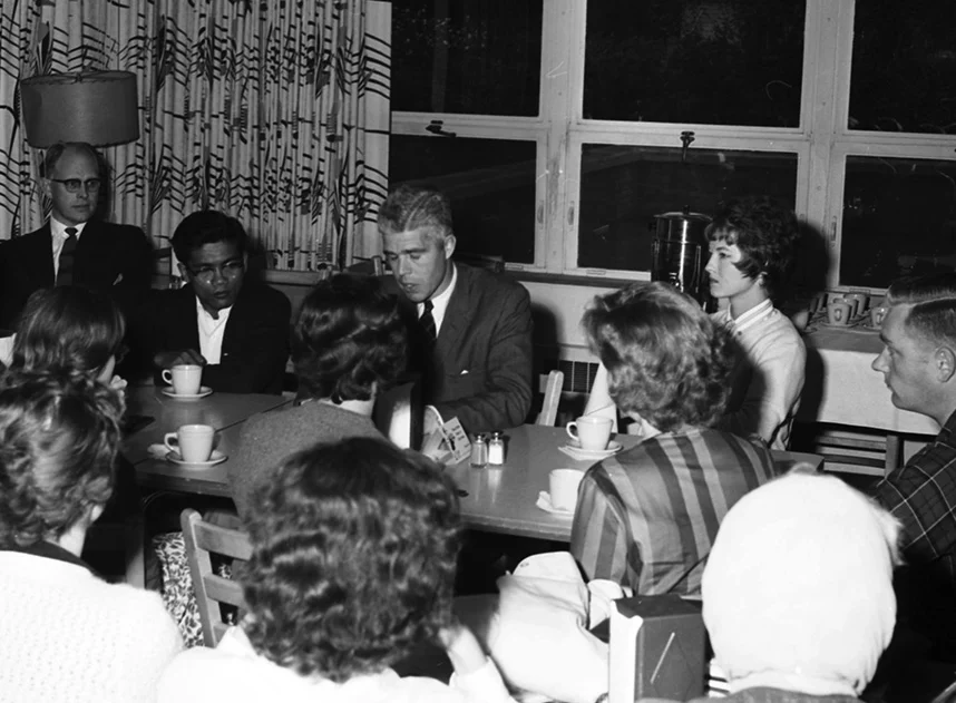 Peace Corps meeting on campus. Maurice Albertson seated back left.