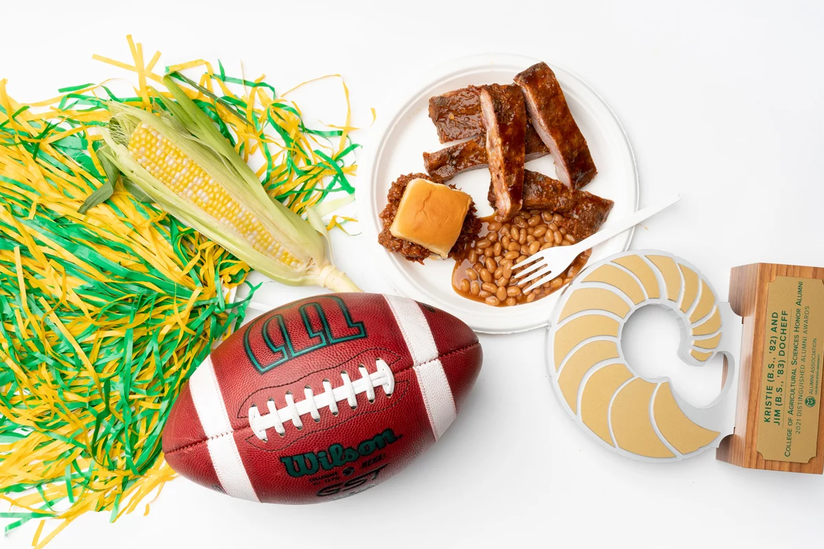 Fall items: pom pom, corn, BBQ, football, DAA award