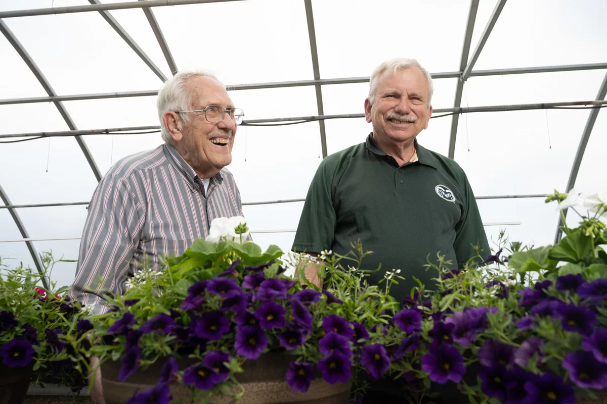 Ken Goldsberry and James Klett in a horticulture greenhouse. PHOTO: John Eisele