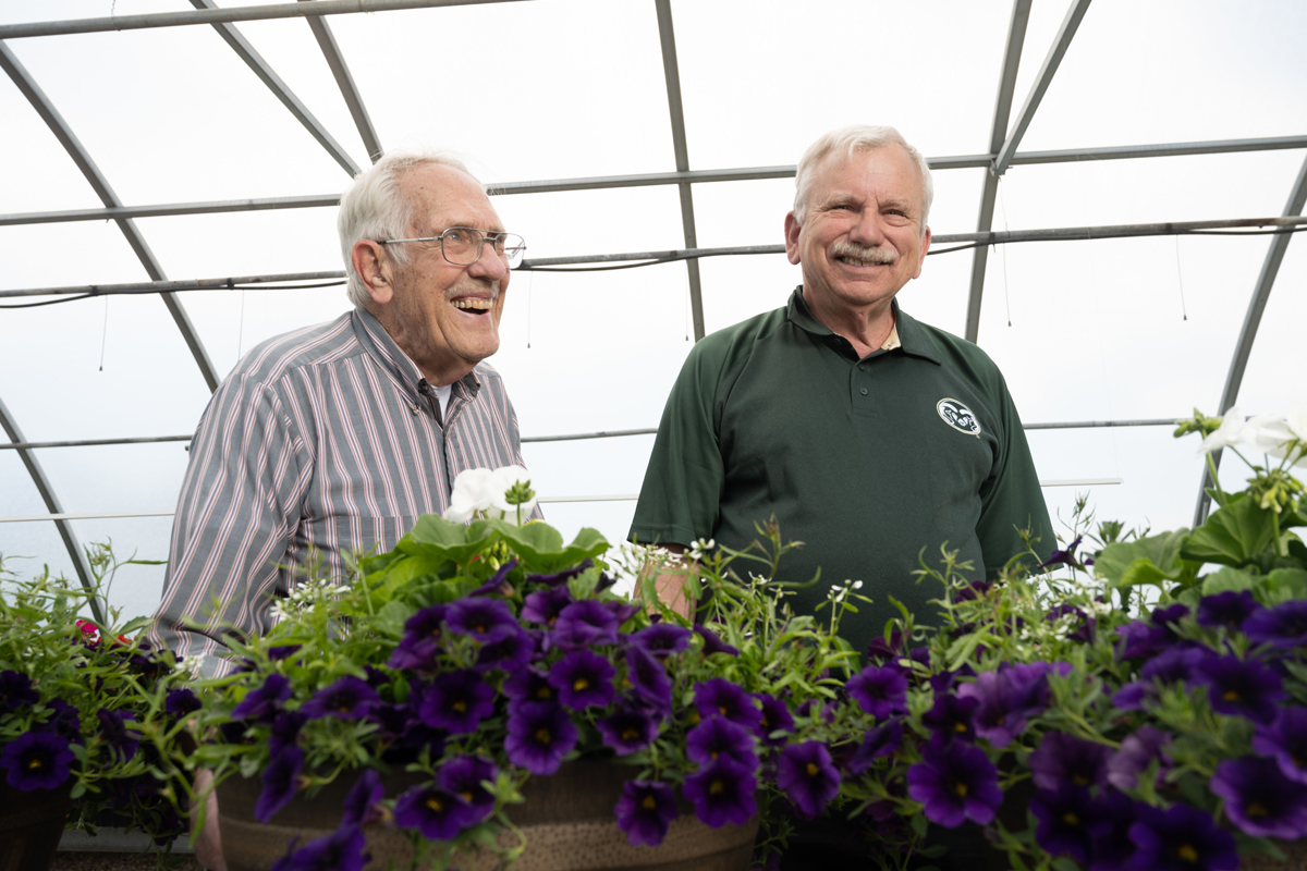 Ken Goldsberry and James Klett in a horticulture greenhouse. PHOTO: John Eisele