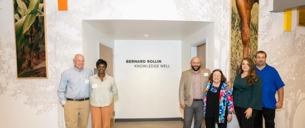 Donors and Bernie Rollin family in front of the Knowledge Well classroom. 